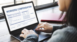 NYC Workers' Compensation Lawyers assisting an injured worker with a workers’ compensation claim online.
